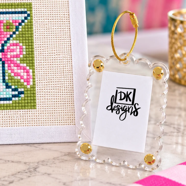 Acrylic Tag-Along Bag Tag: clear scalloped acrylic bag tag with a gold ring for a stitched Small DK Unwind canvas